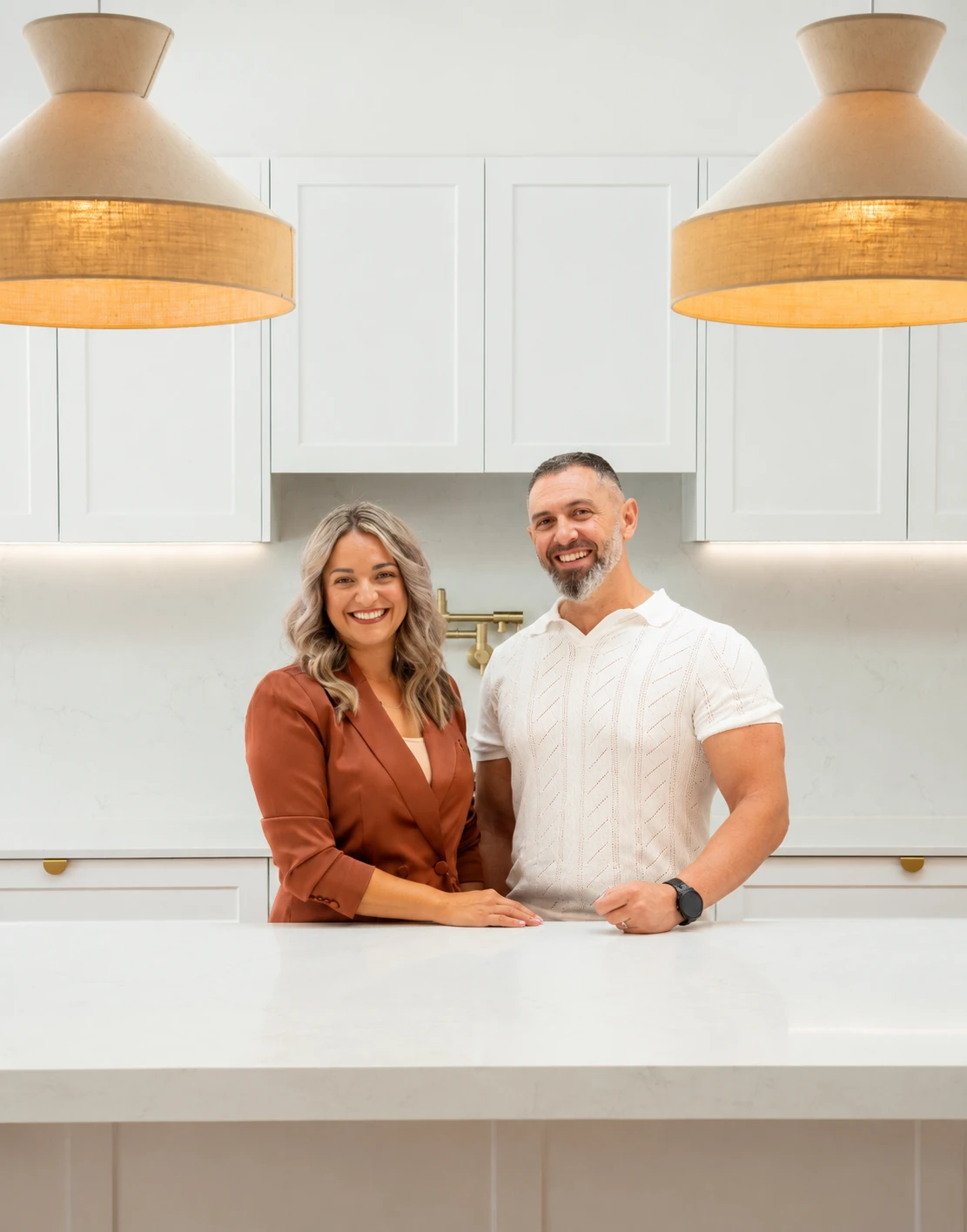Why We Started Empire Buyers Agents Natalina and Andrew from Empire Buyers Agents standing in a modern Gold Coast home
