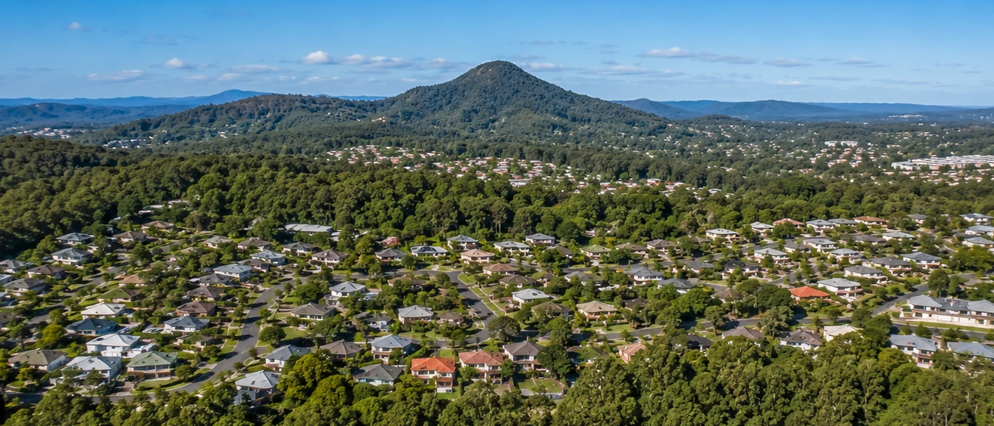 Arundel Buyers Agent aerial view of established homes, leafy streets and green northern Gold Coast surroundings