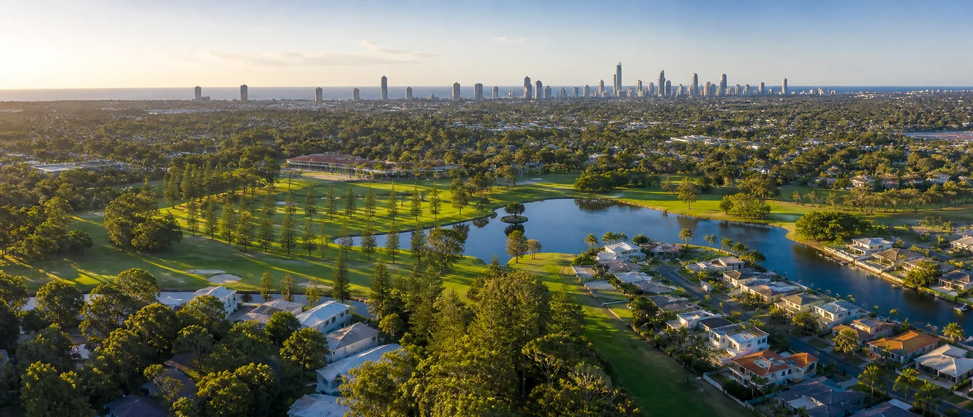 Benowa Buyers Agent aerial view of waterfront homes, established residential areas and the Gold Coast skyline