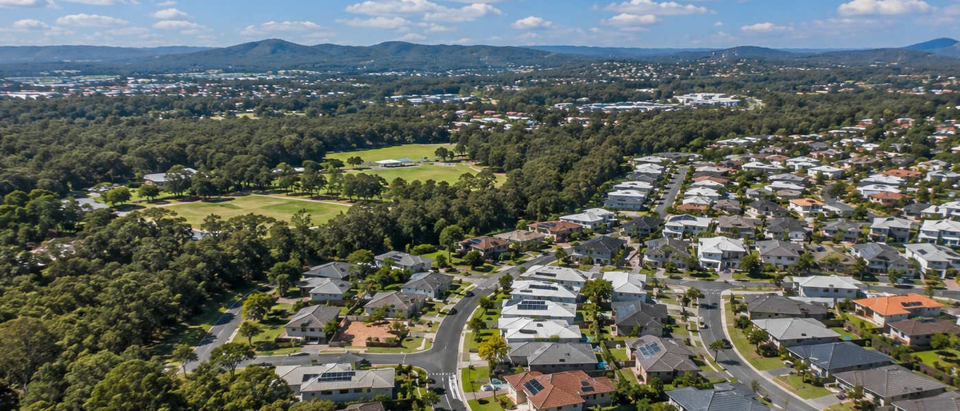 Coomera Buyers Agent aerial view of newer residential estates, family homes and green northern Gold Coast surroundings