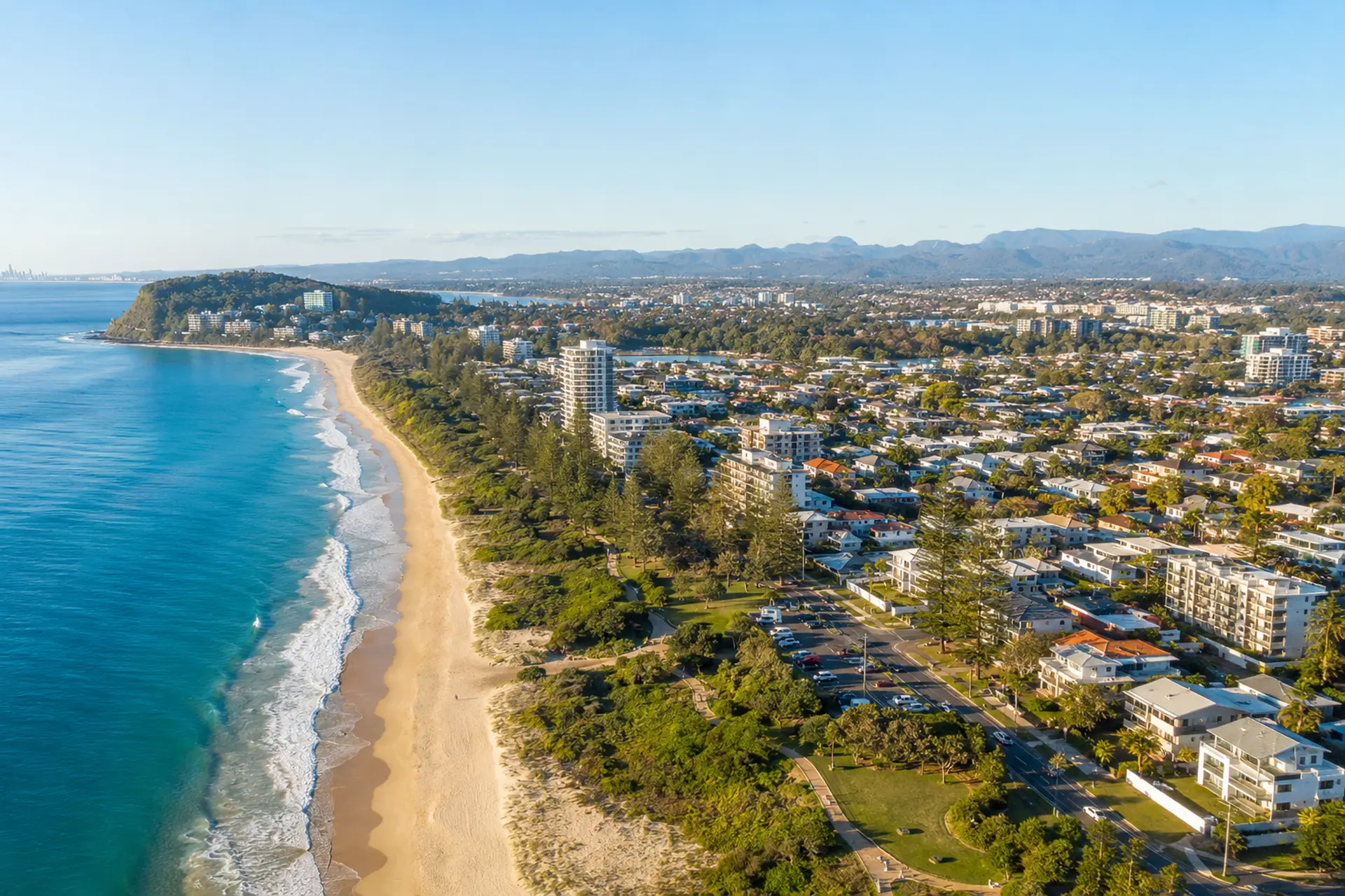 Miami buyers agent aerial view of residential streets, beach and coastline on the Gold Coast