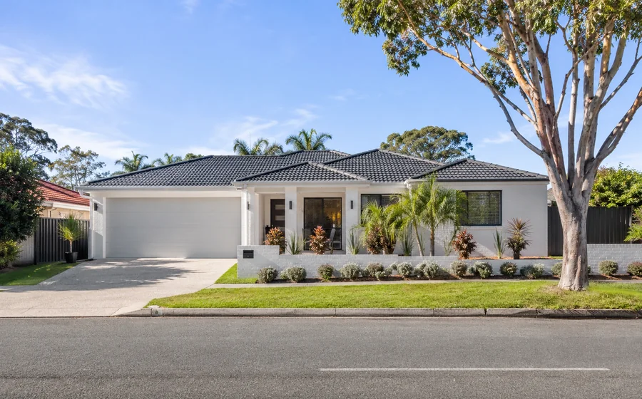 miami family homes Miami buyers agent view of an established family home in a residential Gold Coast street