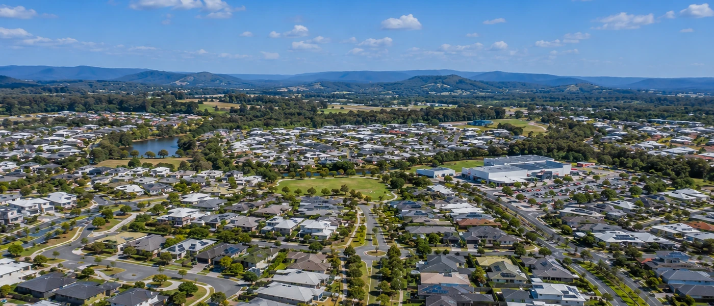 Oxenford Buyers Agent aerial view of established homes, green spaces and leafy northern Gold Coast surroundings