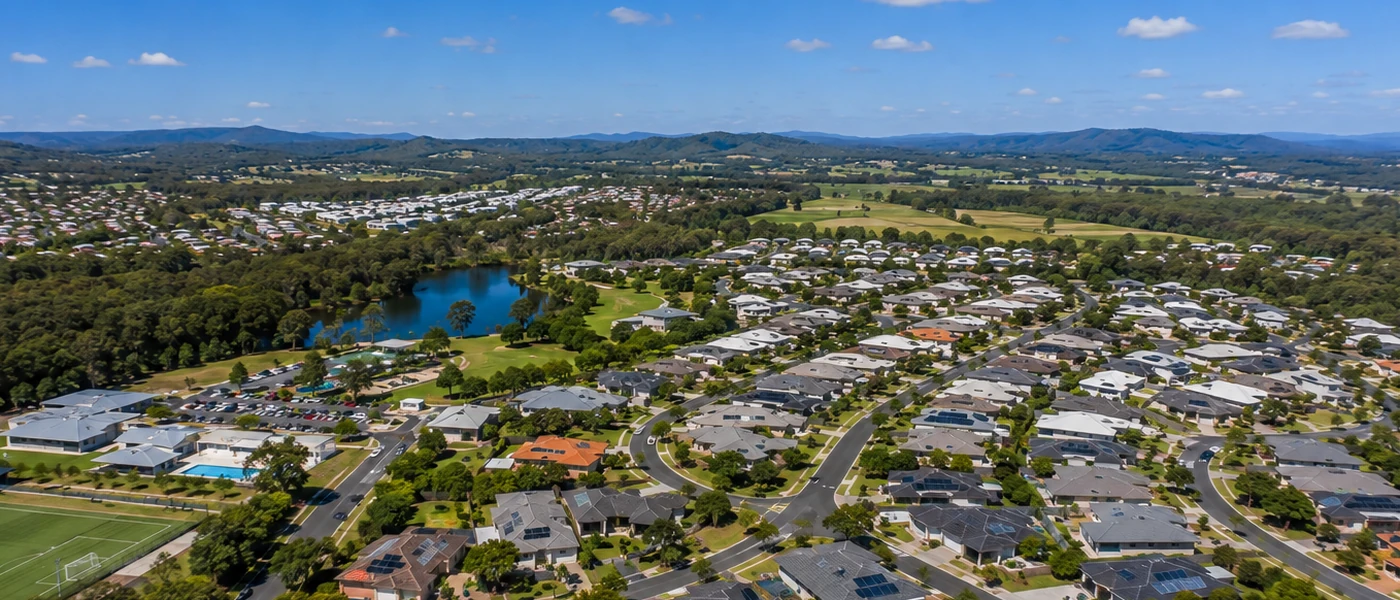Pimpama Buyers Agent aerial view of newer residential estates, family homes and green northern Gold Coast surroundings
