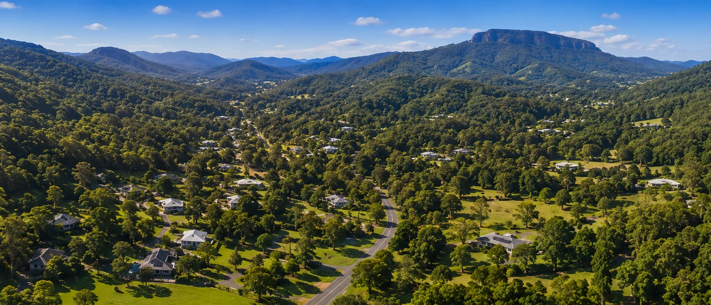Tallai Buyers Agent aerial view of leafy acreage homes, rolling hills and Gold Coast hinterland